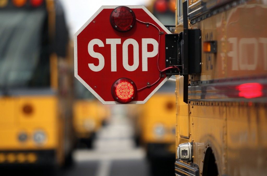 020312 (Damon Higgins/The Palm Beach Post) WEST PALM BEACH - A camera (bottom right) installed on the side of a Palm Beach County school bus just below the stop arm that can capture images of drivers who blow through the stop arm rather than stopping as the law says they should. The district is trying camera systems on two buses.