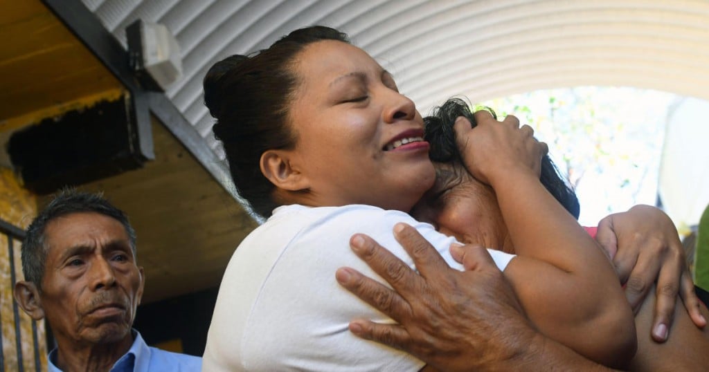 Teodora Vasquez (C) hugs her mother shortly after being released  from the women's Readaptation Center