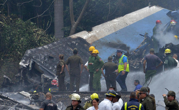 Emergency personnel work at the site of the accident after a Cubana de Aviacion aircraft crashed after taking off from Havana's Jose Marti airport on May 18