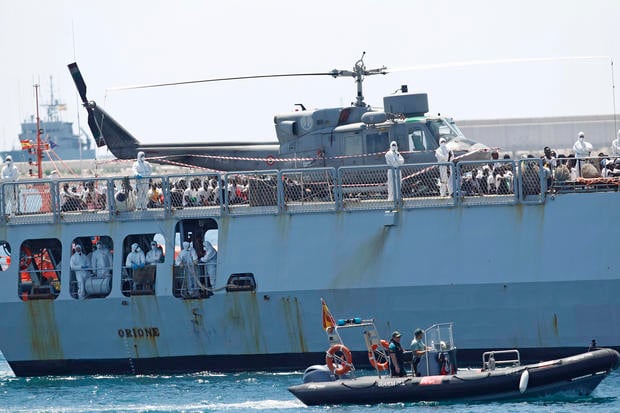 Migrants onboard the French NGO "SOS Mediterranee" Aquarius ship Orione as it arrives at the eastern port of Valencia