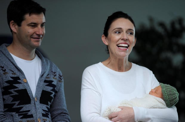 New Zealand Prime Minister Jacinda Ardern carries her newborn baby Neve Te Aroha Ardern Gayford with her partner Clarke Gayfor as she walks out of the Auckland Hospital in New Zealand
