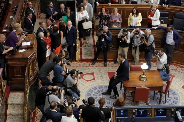 Spain's new Prime Minister and Socialist party (PSOE) leader Pedro Sanchez poses for photographers after a motion of no confidence vote at parliament in Madrid 