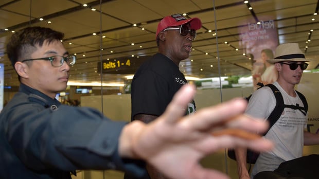 Retired American professional basketball player Dennis Rodman arrives at Changi International airport ahead of US-North Korea summit in Singapore on June 11
