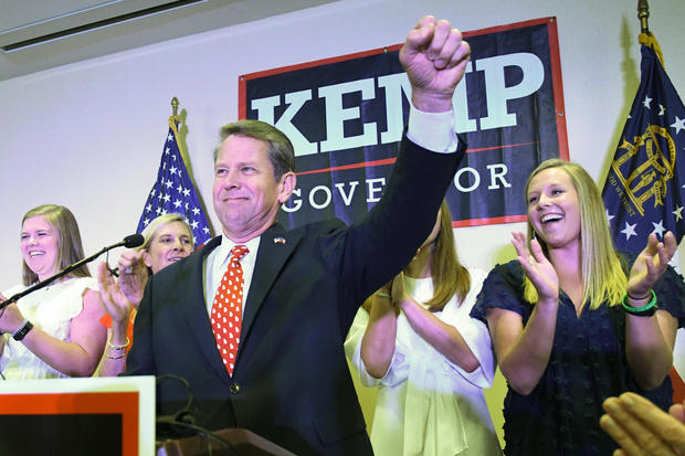 Georgia Republican gubernatorial runoff candidate Brian Kemp goes on stage to declare victory against Casey Cagle during an election night party