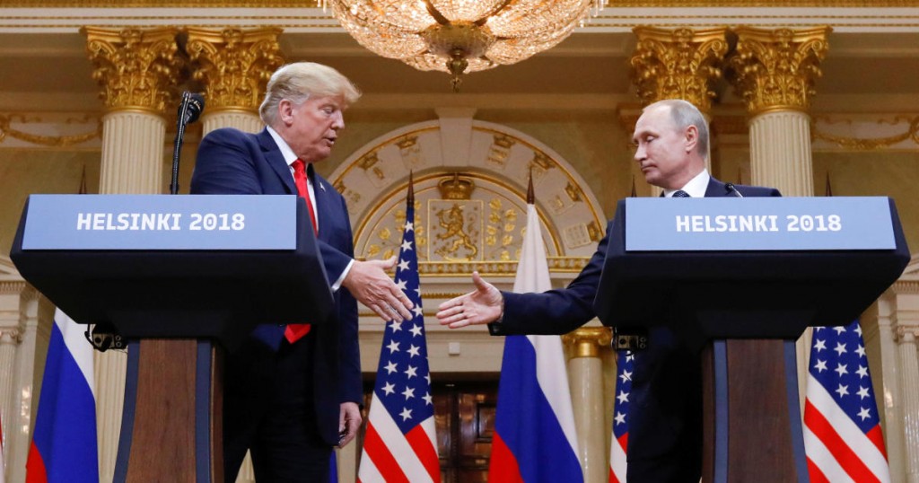 U.S. President Donald Trump and Russia's President Vladimir Putin shake hands during a joint news conference after their meeting in Helsinki
