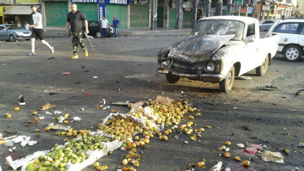 Damages after a suicide bomb attack are seen in Sweida