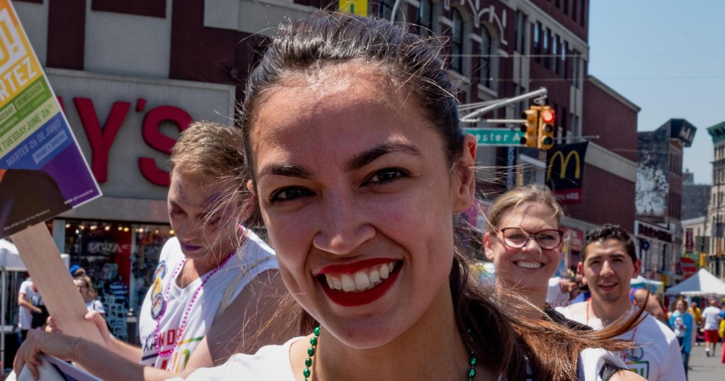Alexandria Ocasio-Cortez marches during the Bronx's pride parade in the Bronx borough of New York City