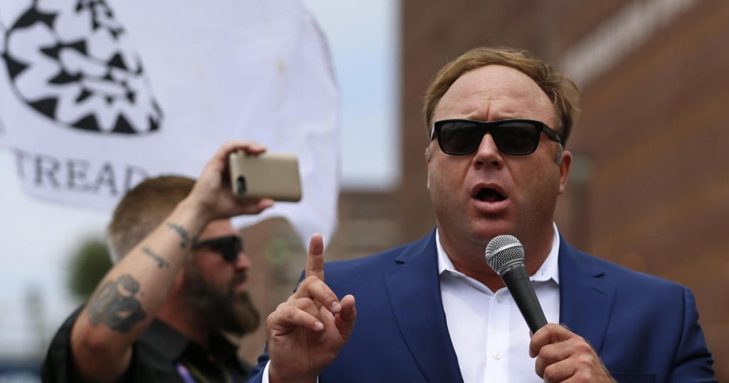 Alex Jones from Infowars.com speaks during a rally in support of Republican presidential candidate Donald Trump near the Republican National Convention in Cleveland