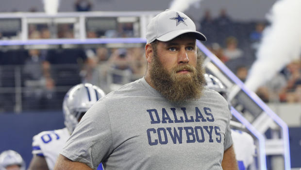 Injured Dallas Cowboys center Travis Frederick (72) runs onto the field before a preseason NFL Football game against the Cincinnati Bengals in Arlington