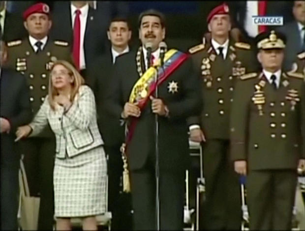 Venezuelan President Nicolas Maduro reacts during an event which was interrupted