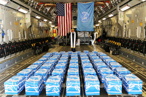 United Nations Command Chaplain U.S. Army Col. Sam Lee performs a blessing of sacrifice and remembrance on the 55 boxes of remains thought to be of U.S. soldiers killed in the 1950-53 Korean War