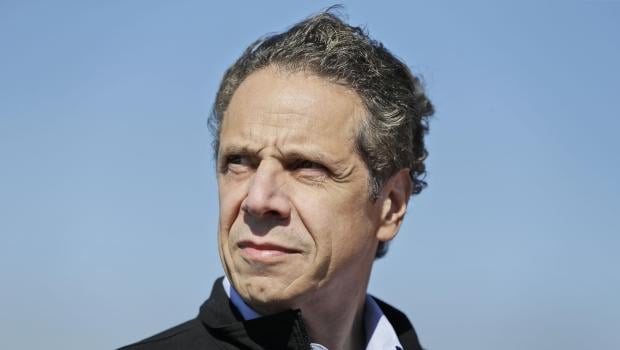 New York Governor Andrew Cuomo watches as a large crane named the Left Coast Lifter arrives at the Tappan Zee Bridge near Nyack