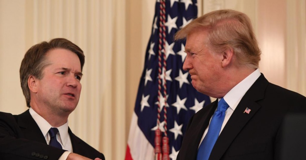 US Judge Brett Kavanaugh (L) shakes hands with US President Donald Trump after being nominated to the Supreme Court in the East Room of the White House on July 9