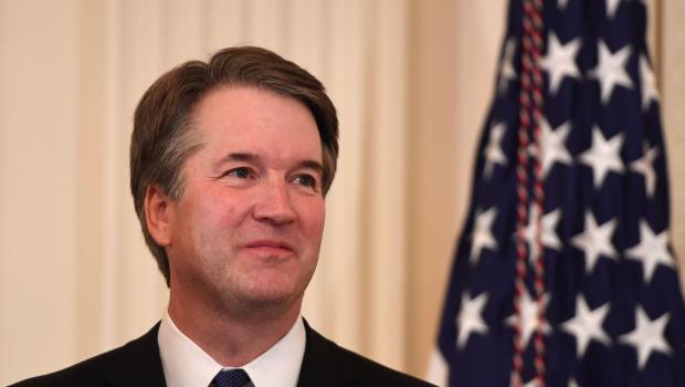 US Judge Brett Kavanaugh looks on as the US President announces him as his nominee to the Supreme Court in the East Room of the White House on July 9