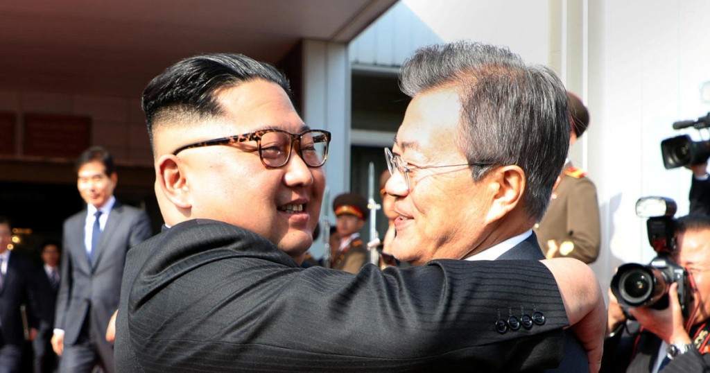 South Korean President Moon Jae-in bids fairwell to North Korean leader Kim Jong Un as he leaves after their summit at the truce village of Panmunjom