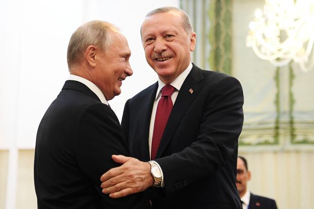 Russia's President Vladimir Putin (L) shakes hands with his Turkey's counterpart Recep Tayyip Erdogan during their meeting in Tehran on September 7