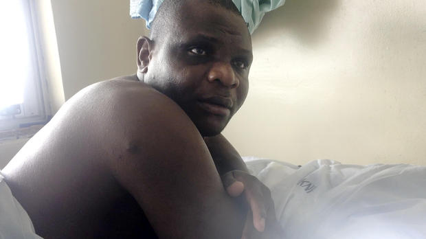 Detained patient Robert Wanyonyi lies on a bed in the Kenyatta National Hospital in Nairobi