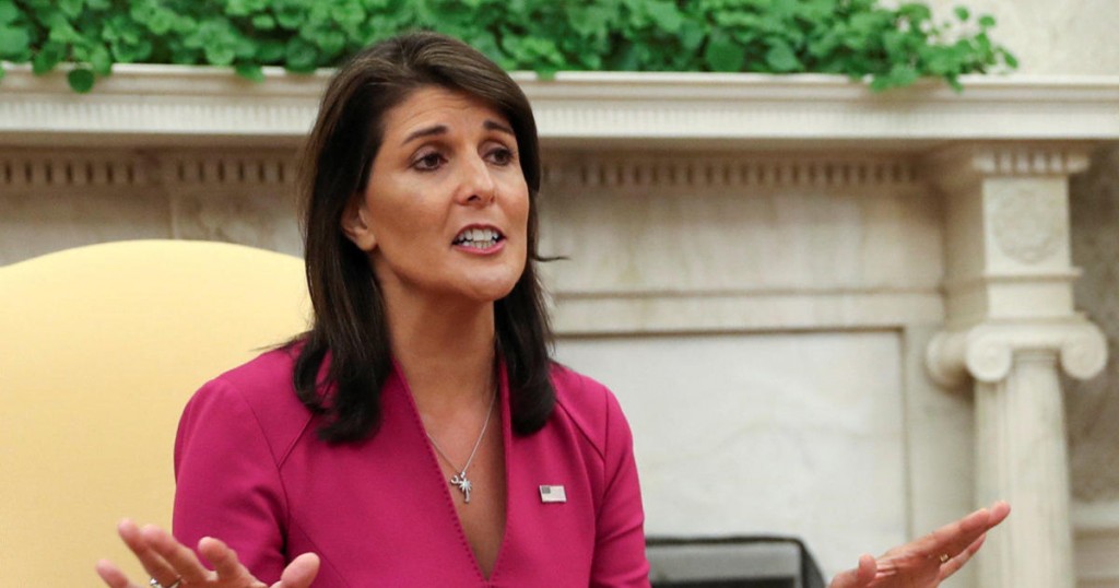 U.S. President Donald Trump listens to U.N. Ambassador Nikki Haley in the Oval Office of the White House after it was announced the president had accepted the Haley's resignation in Washington