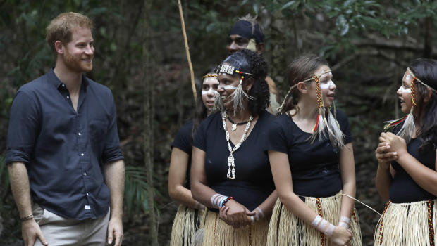 Britain's Prince Harry meets local dancers after the unveiling of the Queens Commonwealth Canopy at Pile Valley