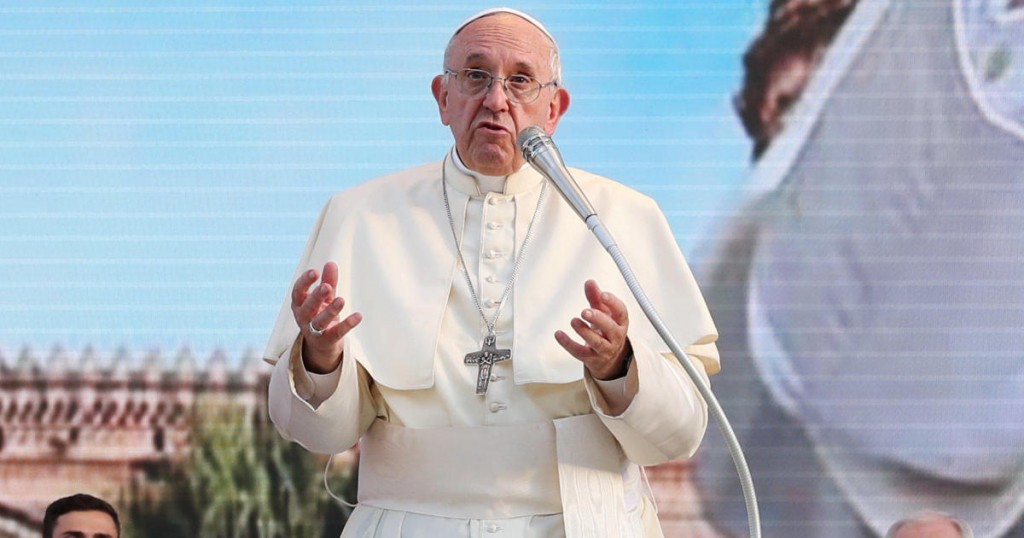 Pope Francis reacts as he meets with young people at the Politeama square in Palermo