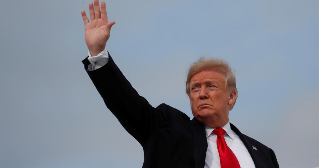 U.S. President Donald Trump waves while boarding Air Force One prior to departing Washington from Joint Base Andrews
