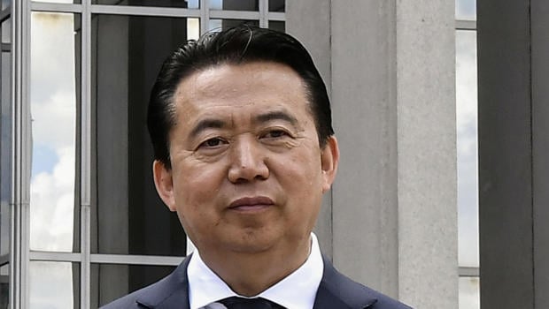 INTERPOL President Meng Hongwei poses during a visit to the headquarters of International Police Organisation in Lyon