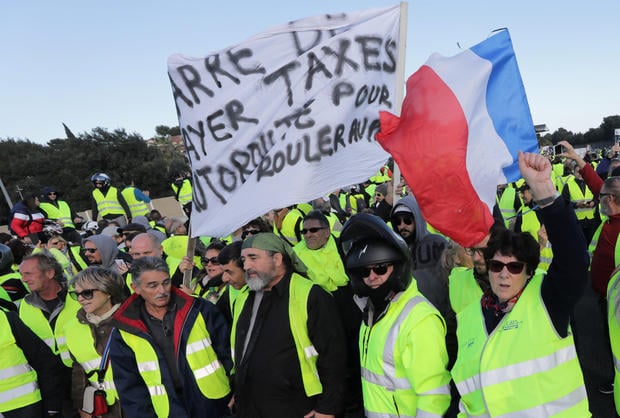 People wearing yellow vests