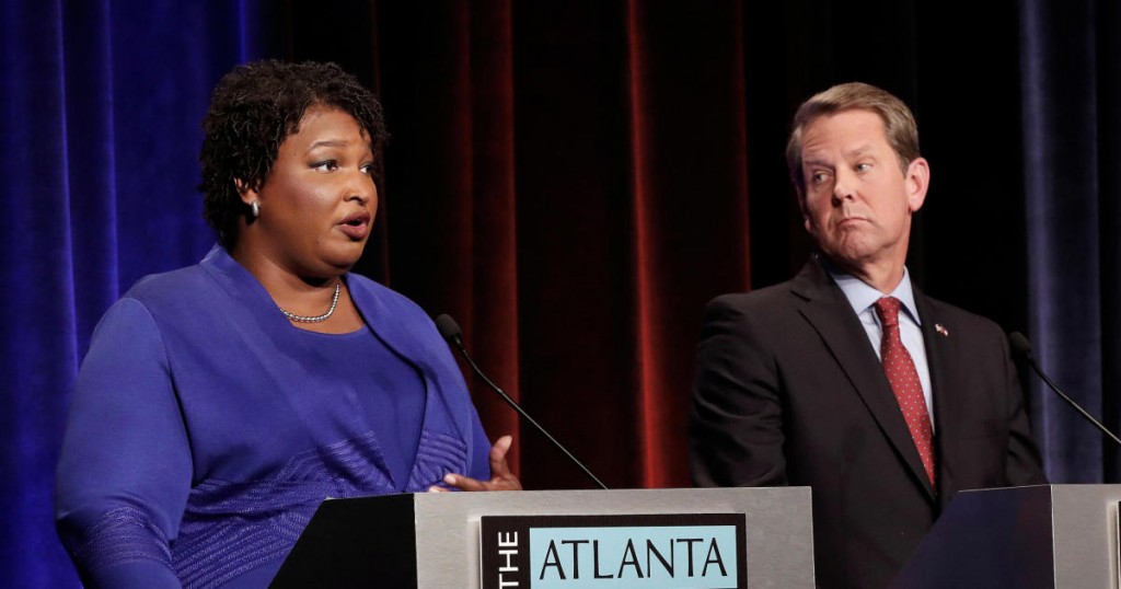 Democratic gubernatorial candidate for Georgia Stacey Abrams speaks as Republican candidate Brian Kemp looks on during a debate in Atlanta