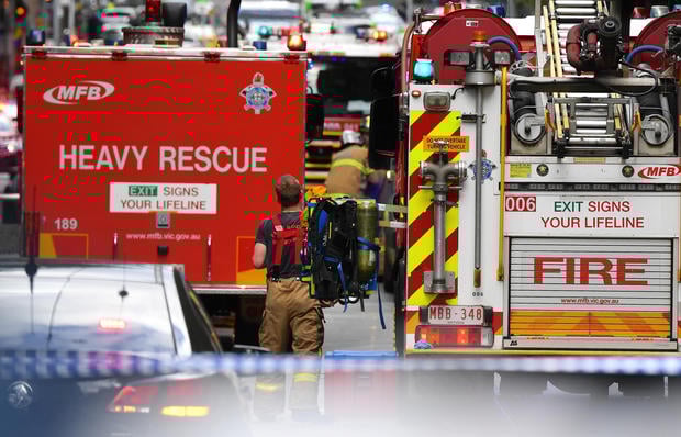 Emergency rescue personnel can be seen near the Bourke Street mall in central Melbourne