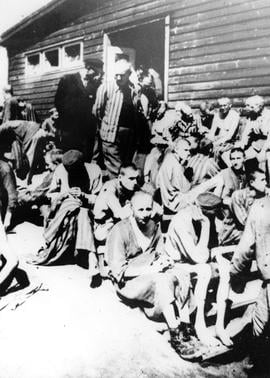 Emaciated prisoners sit outside the hospital barrack in Nazi Germany's Mauthausen concentration camp during World War II. This undated photograph taken at great risk by Swiss prisoner Kurt Zalud