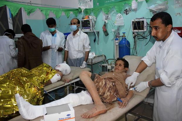 EDITORS NOTE: Graphic content / An injured Yemeni child receives medical aid at an emergency room in the Saada province early on November 20