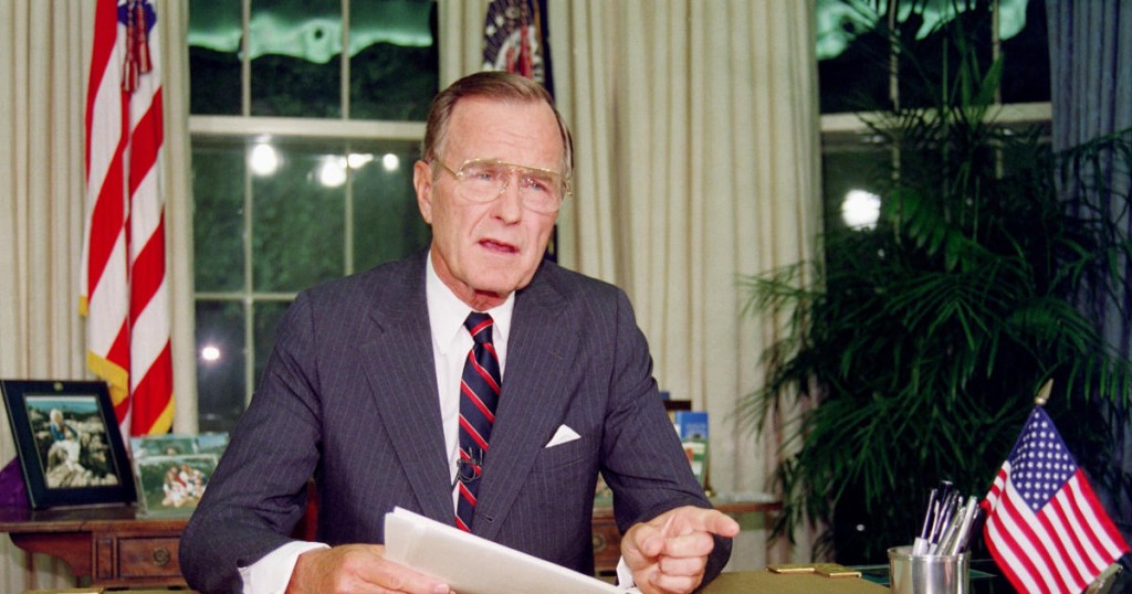 US President George Bush poses for photographers after his address to the nation