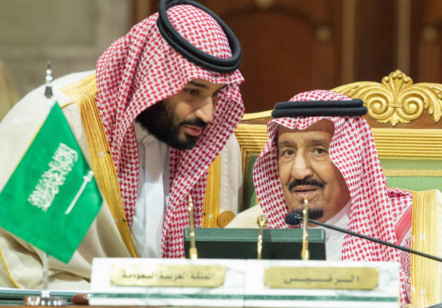 Saudi Arabia's Crown Prince Mohammed bin Salman talks with Saudi Arabia's King Salman bin Abdulaziz Al Saud during the Gulf Cooperation Council's (GCC) Summit in Riyadh