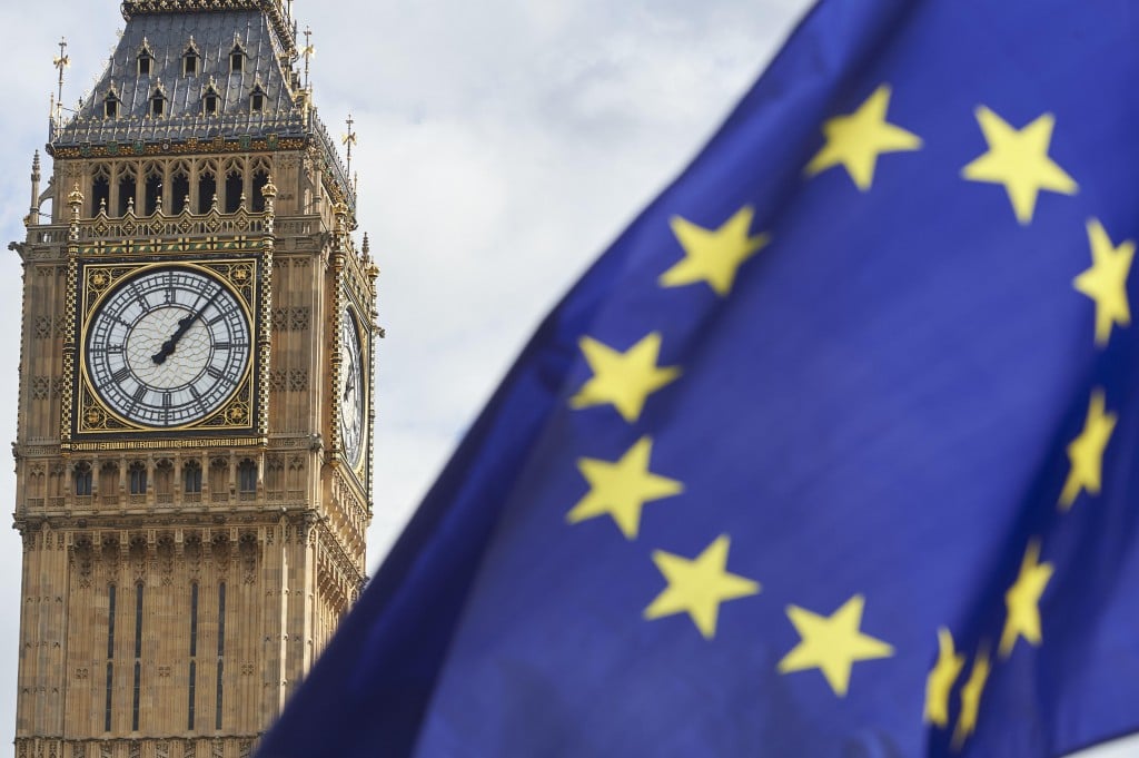 An EU Flag are is seen in front of Elizabeth Tower (Big Ben) during a pro-EU rally at the People's March for Europe against Brexit in Parliament Square in central London on September 9