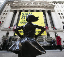 The Fearless Girl statue is unveiled at its new location in front of the New York Stock Exchange