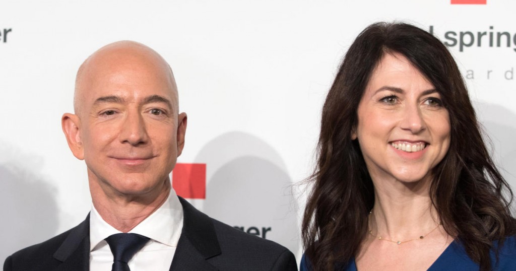 Amazon CEO Jeff Bezos and his wife MacKenzie Bezos  poses as they arrive at the headquarters of publisher Axel-Springer where he will receive the Axel Springer Award 2018 on April 24