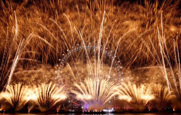 Fireworks explode around the London Eye during New Year's celebrations in central London just after midnight on Jan. 1, 2019. 