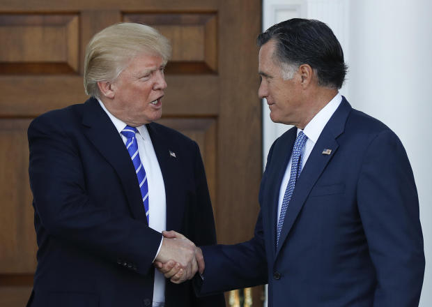 President-elect Donald Trump and Mitt Romney shake hands at the entrance of Trump National Golf Club Bedminster clubhouse in Bedminster