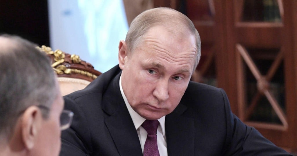 Russian President Vladimir Putin looks on during a meeting with Defence Minister Sergei Shoigu and Foreign Minister Sergei Lavrov at the Kremlin in Moscow