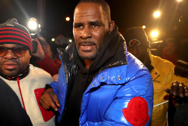 R. Kelly turns himself in at 1st District police headquarters in Chicago on Friday