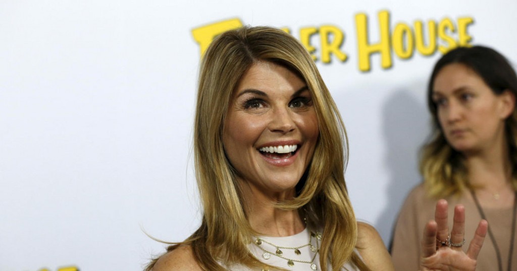 FILE PHOTO: Cast member Lori Loughlin poses at the premiere for the Netflix television series "Fuller House" at The Grove in Los Angeles
