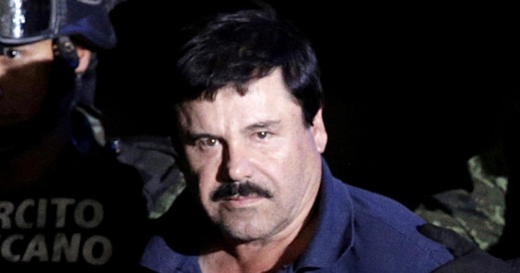 FILE PHOTO: Drug lord Joaquin "El Chapo" Guzman is escorted by soldiers at a hangar belonging to the office of the attorney general in Mexico City