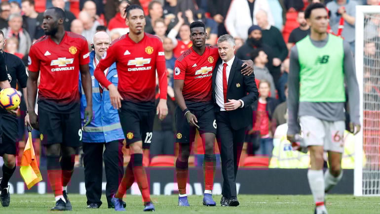 Manchester United's Paul Pogba (third right) hugs Manchester United caretaker manager Ole Gunnar Solskjaer at the end of the Premier League match at Old Trafford