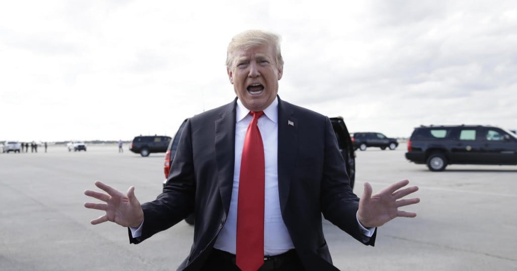 President Donald Trump talks to the media before boarding Air Force One