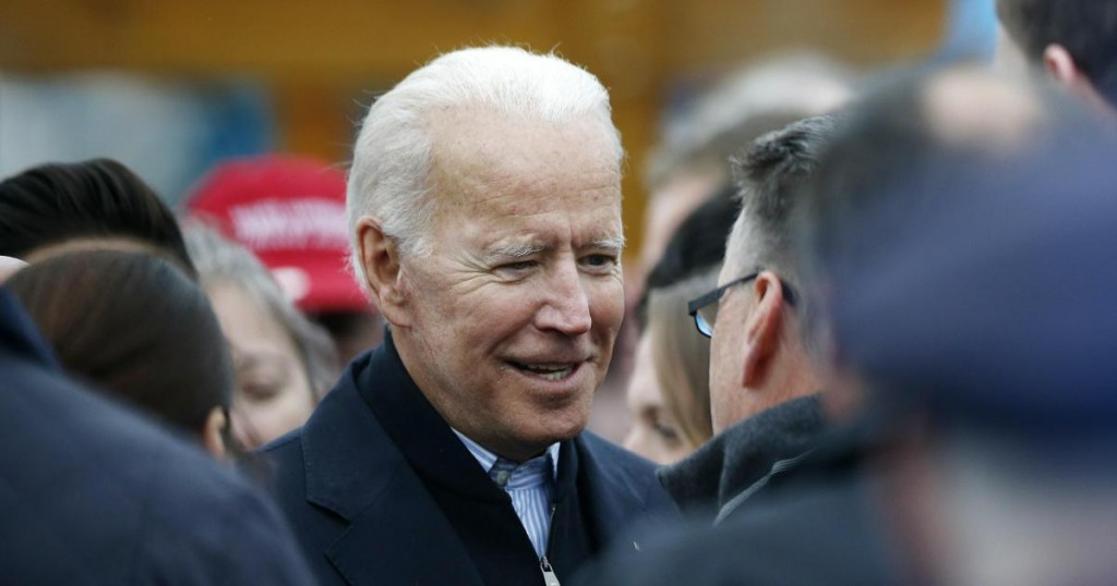 Former vice president Joe Biden talks with officials after speaking at a rally in support of striking Stop & Shop workers in Boston
