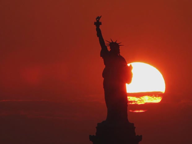 statue-of-liberty-sunset-silhouette-promo.jpg 