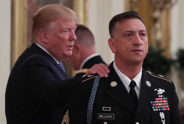 Medal of Honor recipient David G. Bellavia listens as U.S. President Donald Trump acknowledges Bellavia during a ceremony in the East Room of the White House in Washington
