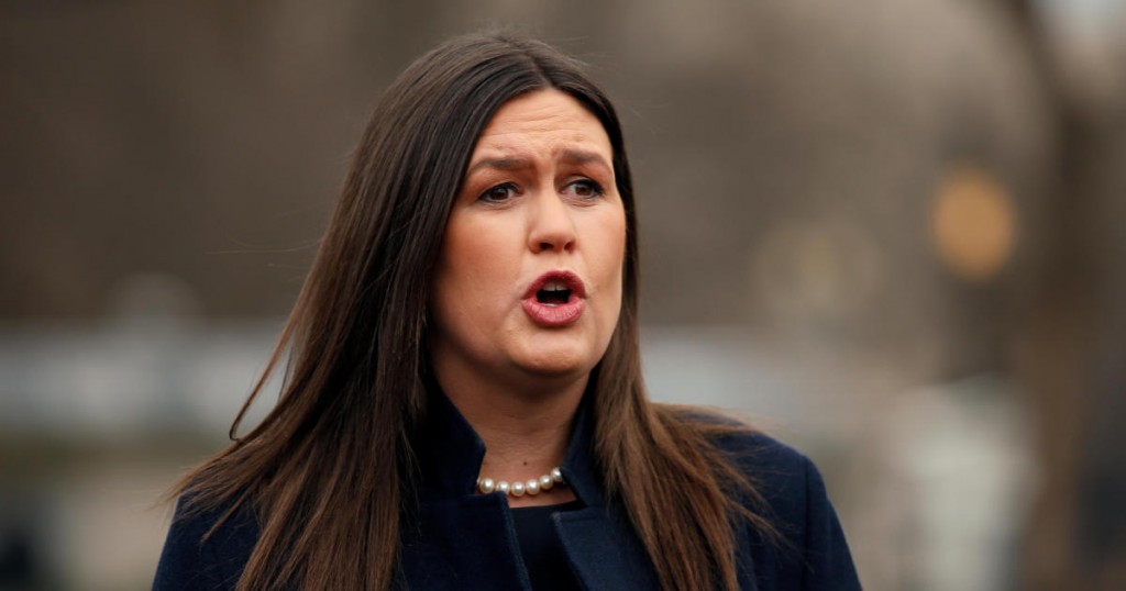 White House press secretary Sarah Sanders speaks to reporters outside the White House in Washington