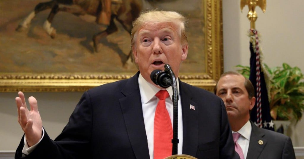 US President Donald Trump and Secretary of Health and Human Services Alex Azar (R) gives brief remarks on the Administration's actions to combat the opioid crisis and announced $1.8B in grants to states and cities to assist in their responses to this crisis during an event at the White House in Washington