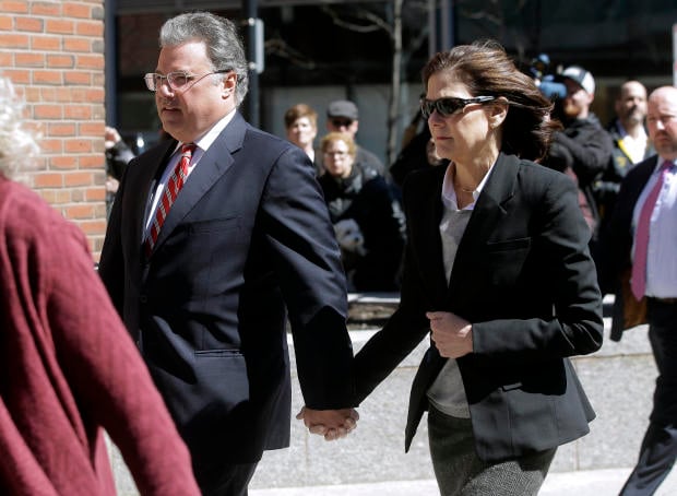 Manuel and Elizabeth Henriquez arrive at federal court in Boston on Wednesday